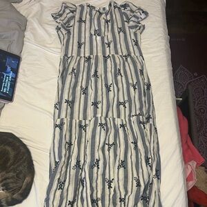 Elegant Striped Maxi Dress with Floral Accents